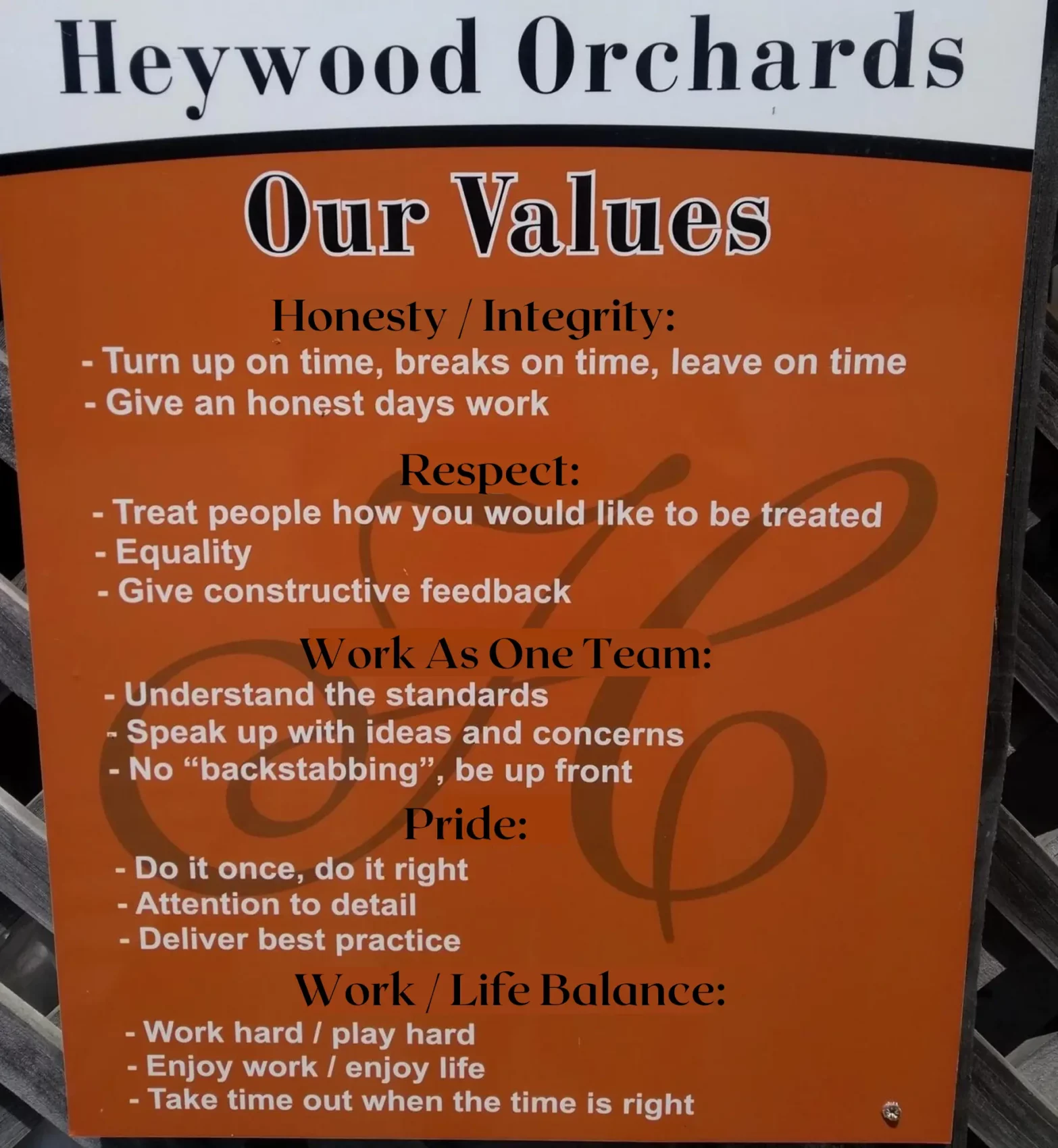 Sign showing Heywood Orchards workplace values